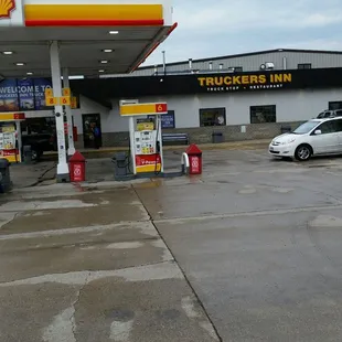a truck parked in front of a gas station