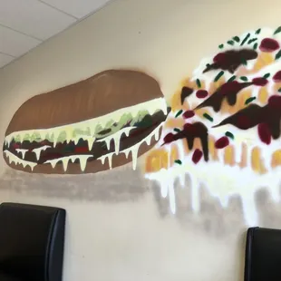  large hamburger painted on a wall