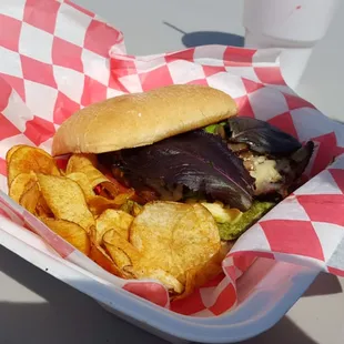 a burger and chips in a basket