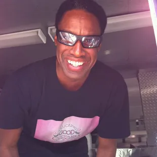 a smiling man in a truck