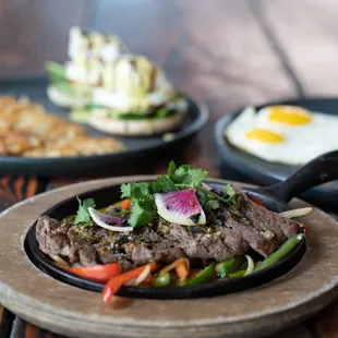 two plates of food on a wooden table