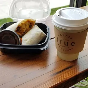 a burrito and a cup of coffee