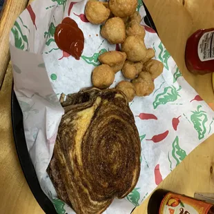 Patty melt and fried mushrooms with a shiner bock peach.  Like sucking a jolly rancher while drinking a beer LOL