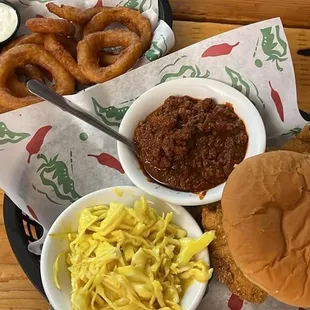 Veal Sandwich with slaw &amp; chili and onion rings.