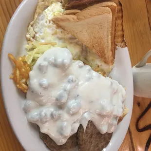 Eggs over medium, hash browns with gravy, sausage patties, and toast.  Everything was good.
