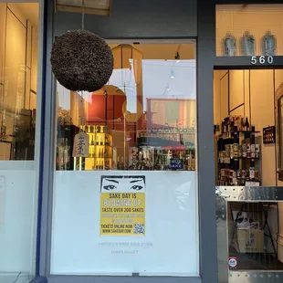a storefront with a sign in the window