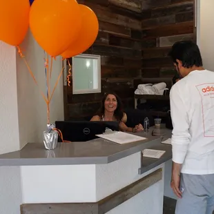 Helena, the owner, at the check-in desk