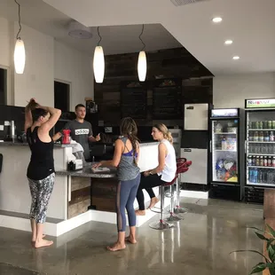 True Juice juice bar (Pre-covid photo). Coconut waters, electrolyte water, kombuchas, and bottled water are available for purchase.