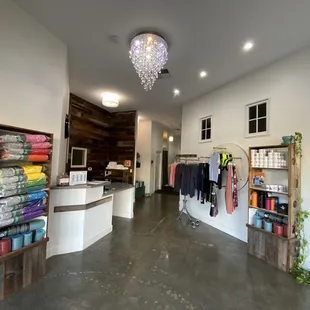 Beautiful lobby! Mats, towels, yoga clothes, water bottles, plant protein powder, and electrolyte powder available for purchase