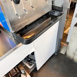 a kitchen with a sink and a counter