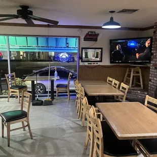 Dining area with tv and windows