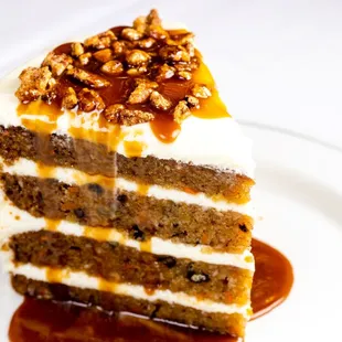 WORLD CLASS CARROT CAKE cream cheese icing, spicy pecans and warm butterscotch