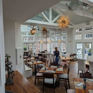 a dining room with tables and chairs