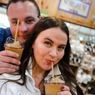 a man and a woman drinking iced coffee