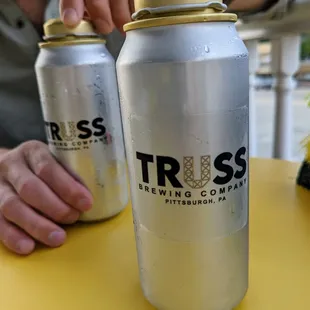 a man holding a can of beer