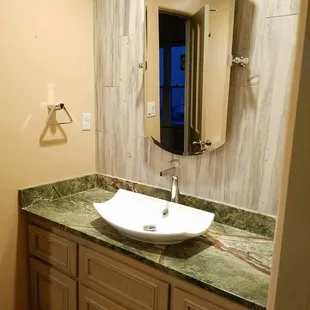a sink and mirror in a bathroom