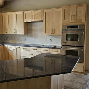 a kitchen with granite counter tops