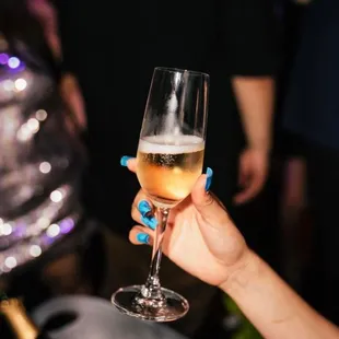 a person holding a glass of wine