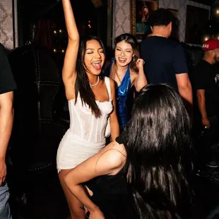 a group of people dancing at a party