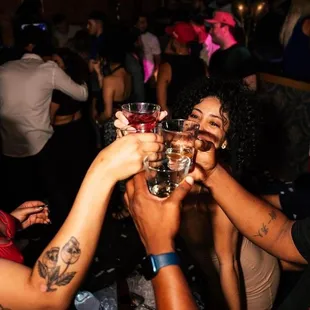 a group of people toasting at a party