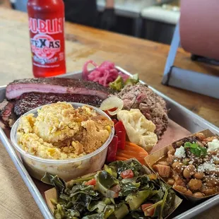 3 meet-pork ribs, brisket, pulled pork sides - corn pudding, collards and coleslaw. Dublin TX red creme soda