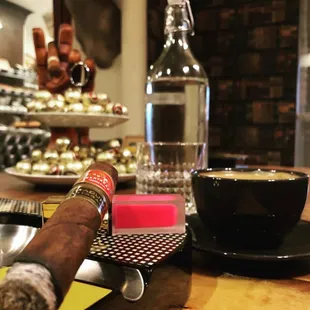 a cigar and a cup of coffee