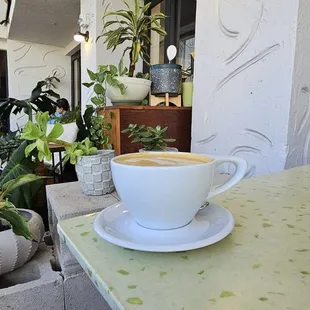 a cup of coffee on a table