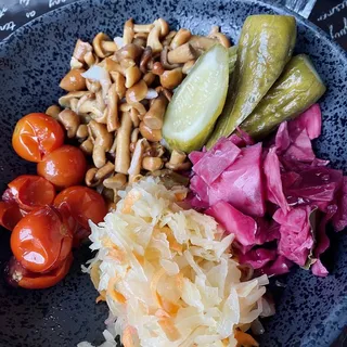 Pickled Vegetable Medley pickles, fermented tomatoes, sauerkraut, mushrooms, purple cabbage, red onions