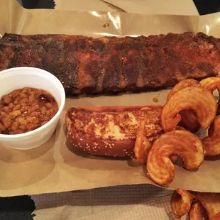 Rack of ribs, BBQ baked beans and fries.