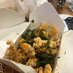 a box of fried food on a table