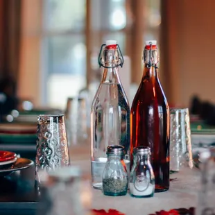 a table set with empty wine bottles
