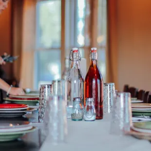 a woman setting a dining table