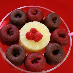 Chocolate and Red-Velvet flavored mini cake donuts...with  sweet delicious pineapples and raspberries in the middle...taste just