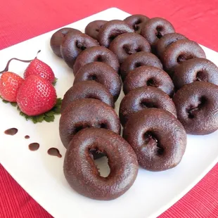 Chocolate flavored Mini Cake Donuts with a Chocolate topping and a Strawberry