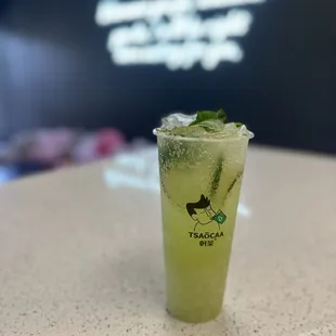 a drink in a glass on a table