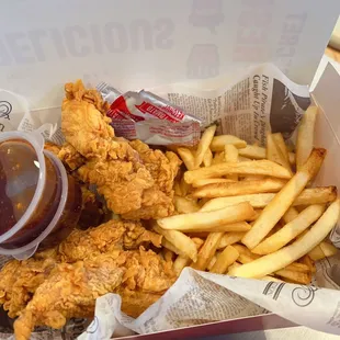 a basket of fried chicken and french fries