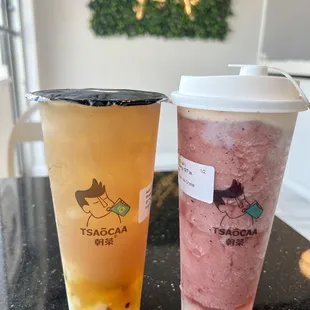 Pineapple and passion fruit green tea , blueberry green tea with milk foam