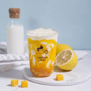 a cup of iced tea with a lemon slice next to it