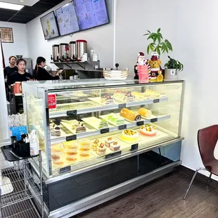 a display case of pastries in a bakery