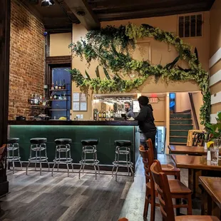 a woman standing at the bar