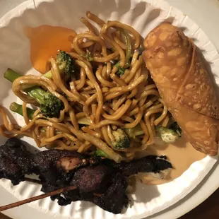 Smorgasbord of their veg lo mein, chicken skewers, and an egg roll