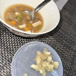 a bowl of soup and a spoon