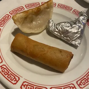 The eggroll was super crispy and delicious but the Paper Wrapped Chicken wasn't very good and the Pot Stickers was mid.