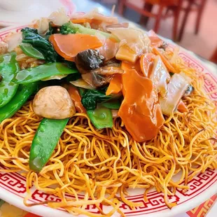 a plate of noodles and vegetables