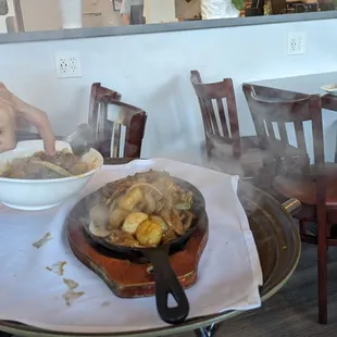 Sizzling Beef &amp; Scallops being sizzled