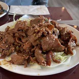 Amazing tender and delicious. "Tsing Tao beef" on a bed of lettuce sprinkled in sesame seeds highly recommend (taste like Korean BBQ)