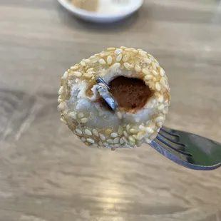 a person holding a piece of food