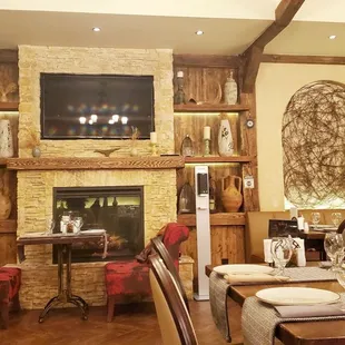 a dining room with a fireplace