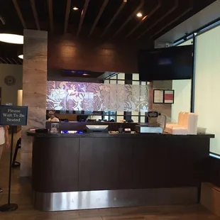 a woman standing in front of the counter