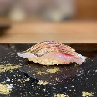 a piece of sushi on a table